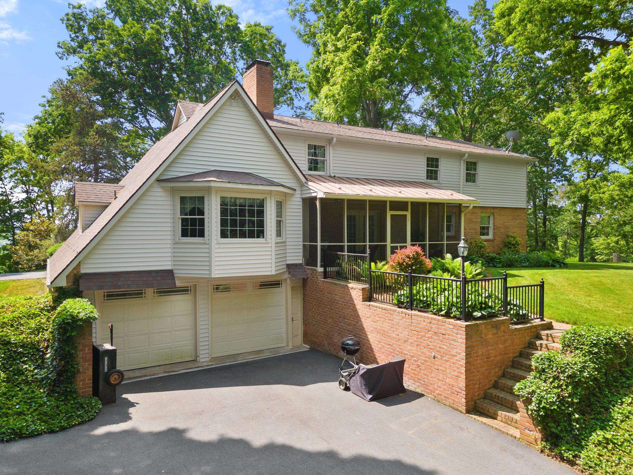 88 Roman Ridge Road Mount Sidney, VA 24467 - Photo 12 of 74 a front view of a house with a yard and potted plants
