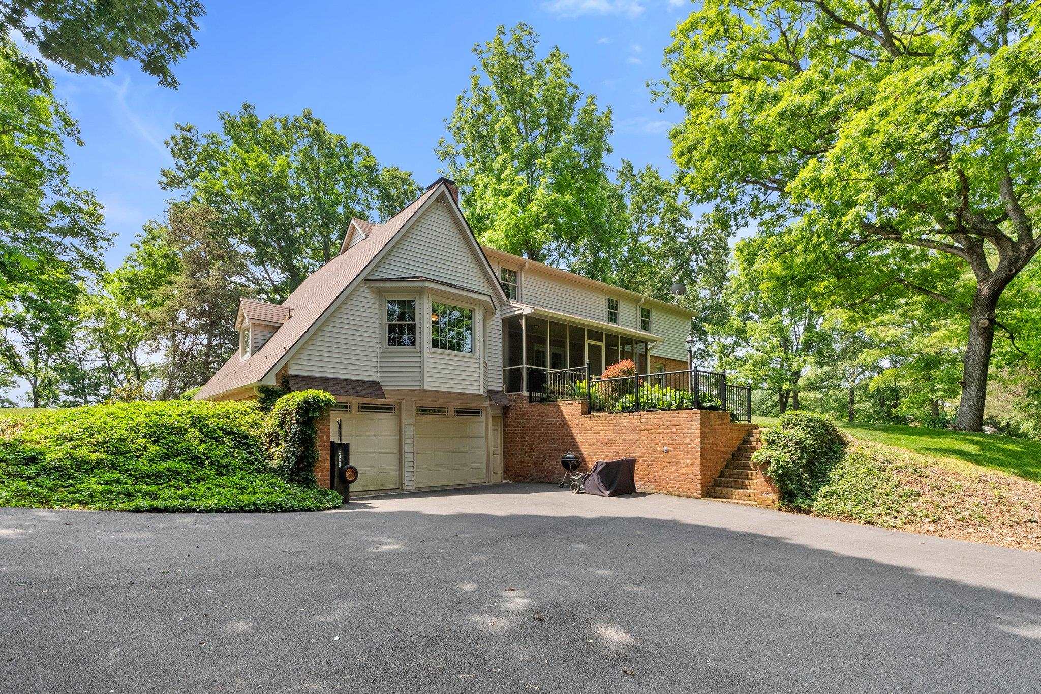 88 Roman Ridge Road Mount Sidney, VA 24467 - Photo 13 of 74 a front view of a house with a yard and a garage