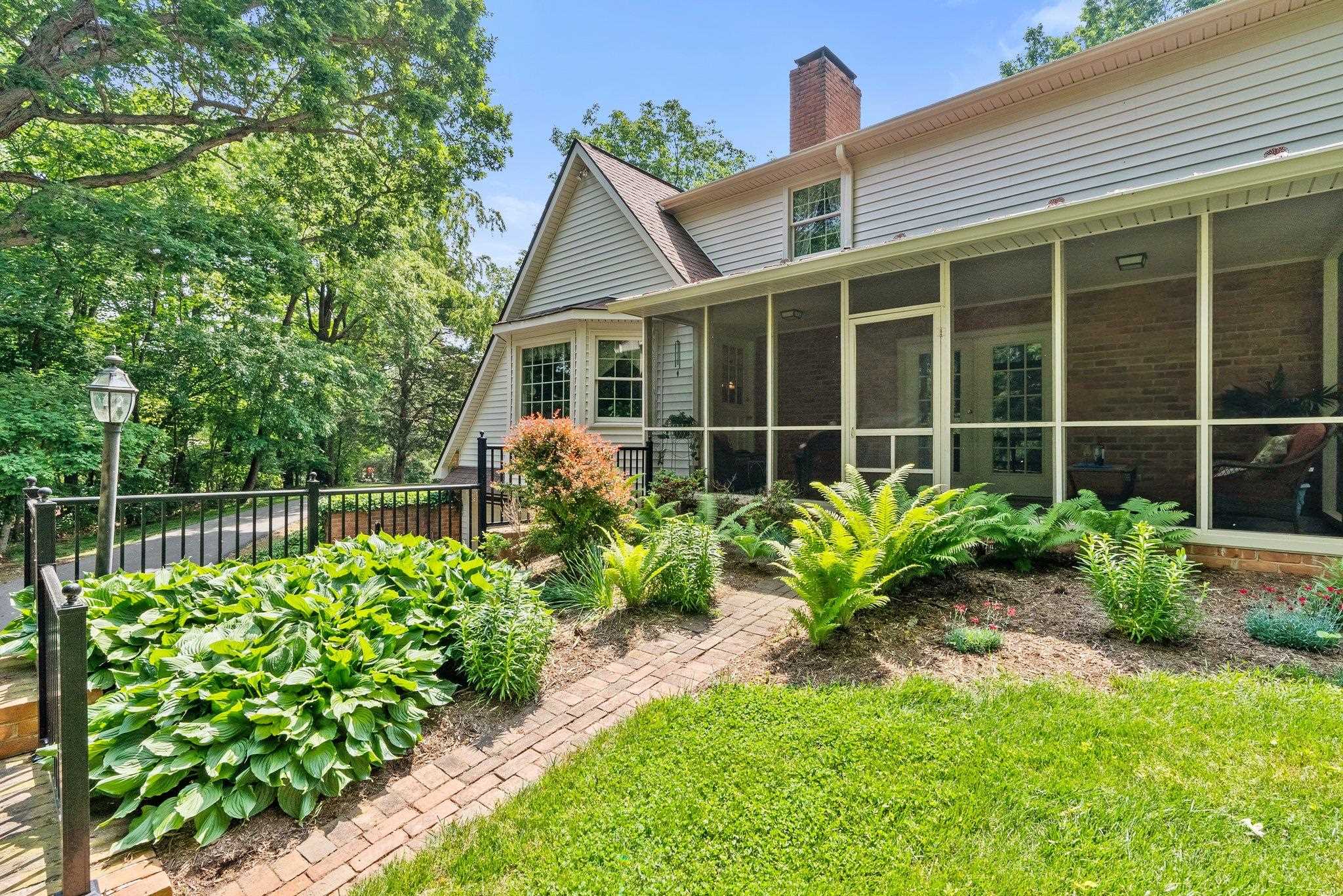 88 Roman Ridge Road Mount Sidney, VA 24467 - Photo 14 of 74 a house with a flower garden in front of it