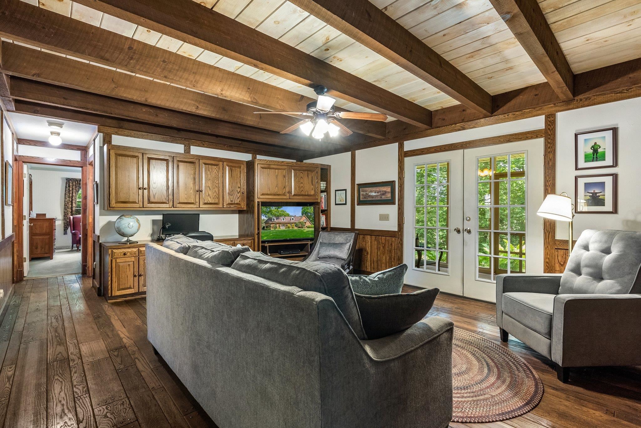 88 Roman Ridge Road Mount Sidney, VA 24467 - Photo 27 of 74 a living room with furniture floor to ceiling window and wooden floor
