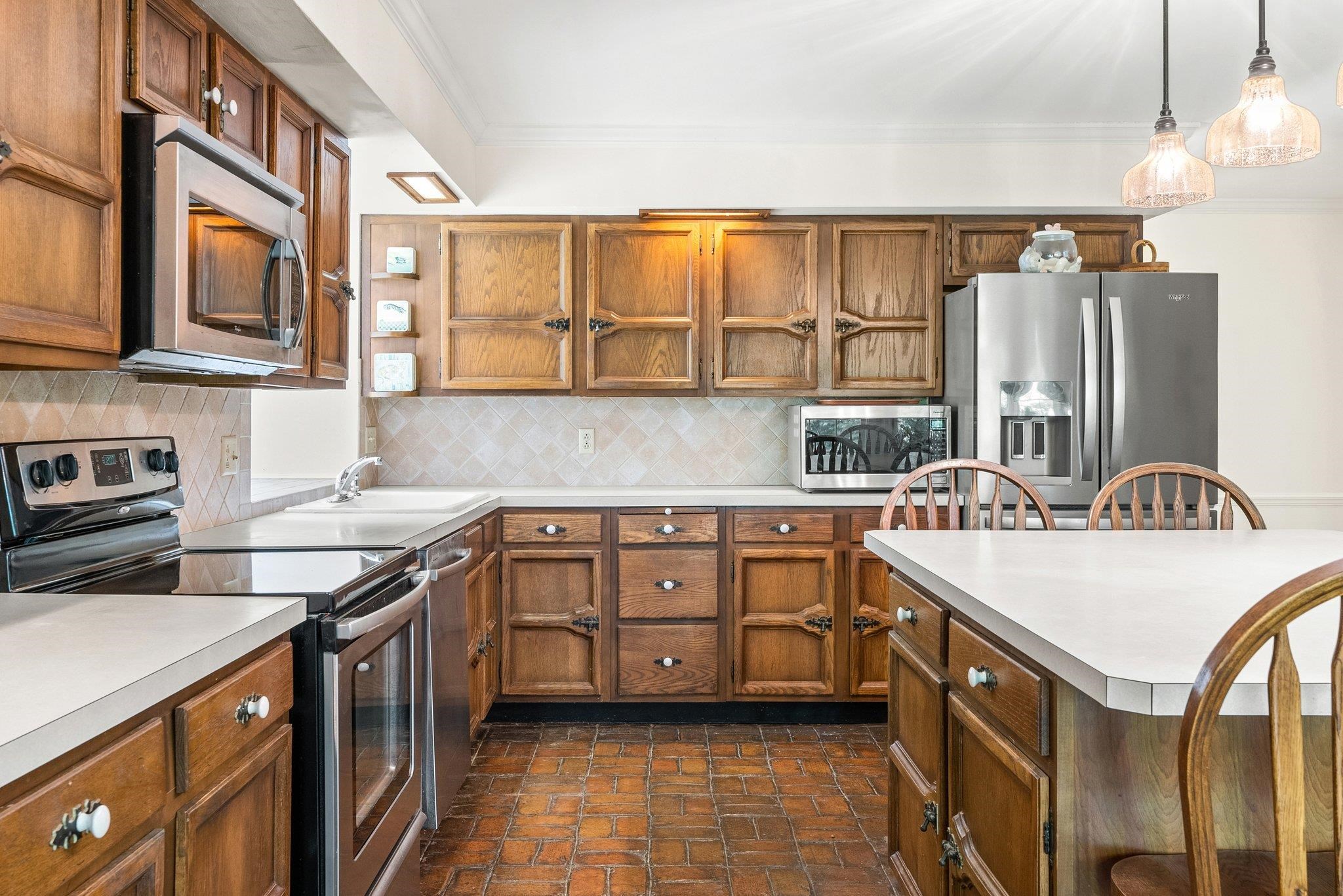 88 Roman Ridge Road Mount Sidney, VA 24467 - Photo 38 of 74 a kitchen with stainless steel appliances granite countertop a sink and a stove
