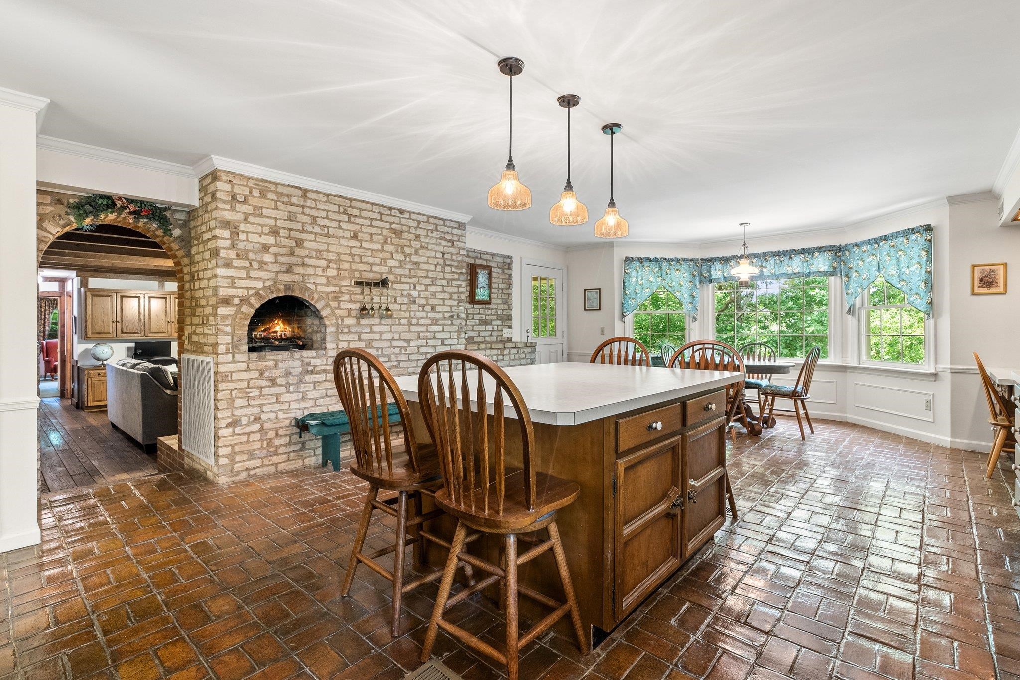 88 Roman Ridge Road Mount Sidney, VA 24467 - Photo 39 of 74 a kitchen with stainless steel appliances granite countertop a stove a sink a refrigerator dining table and chairs