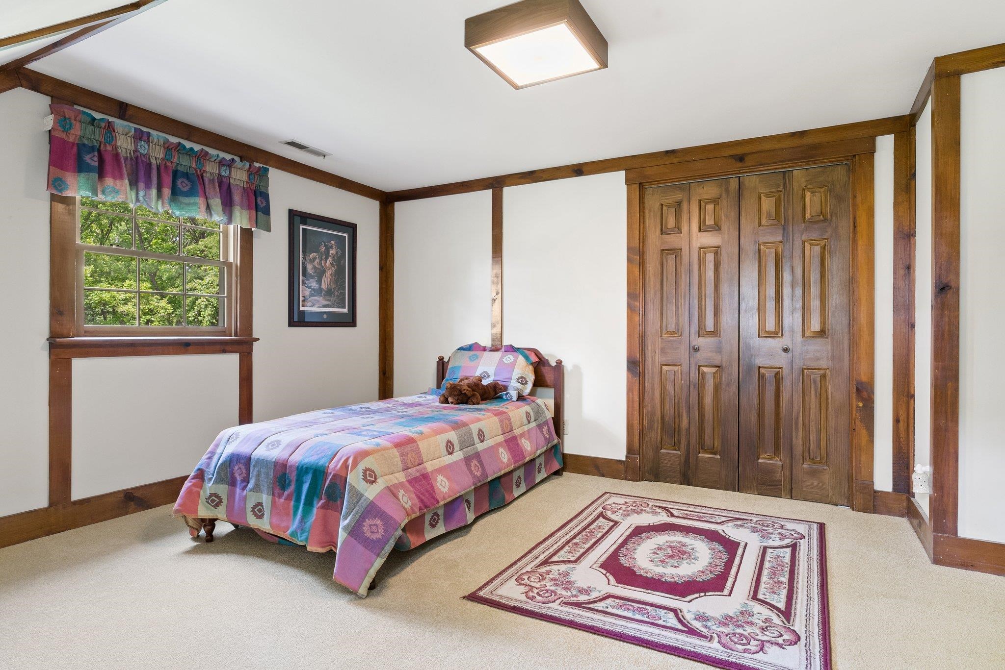 88 Roman Ridge Road Mount Sidney, VA 24467 - Photo 54 of 74 a bedroom with a bed and a window