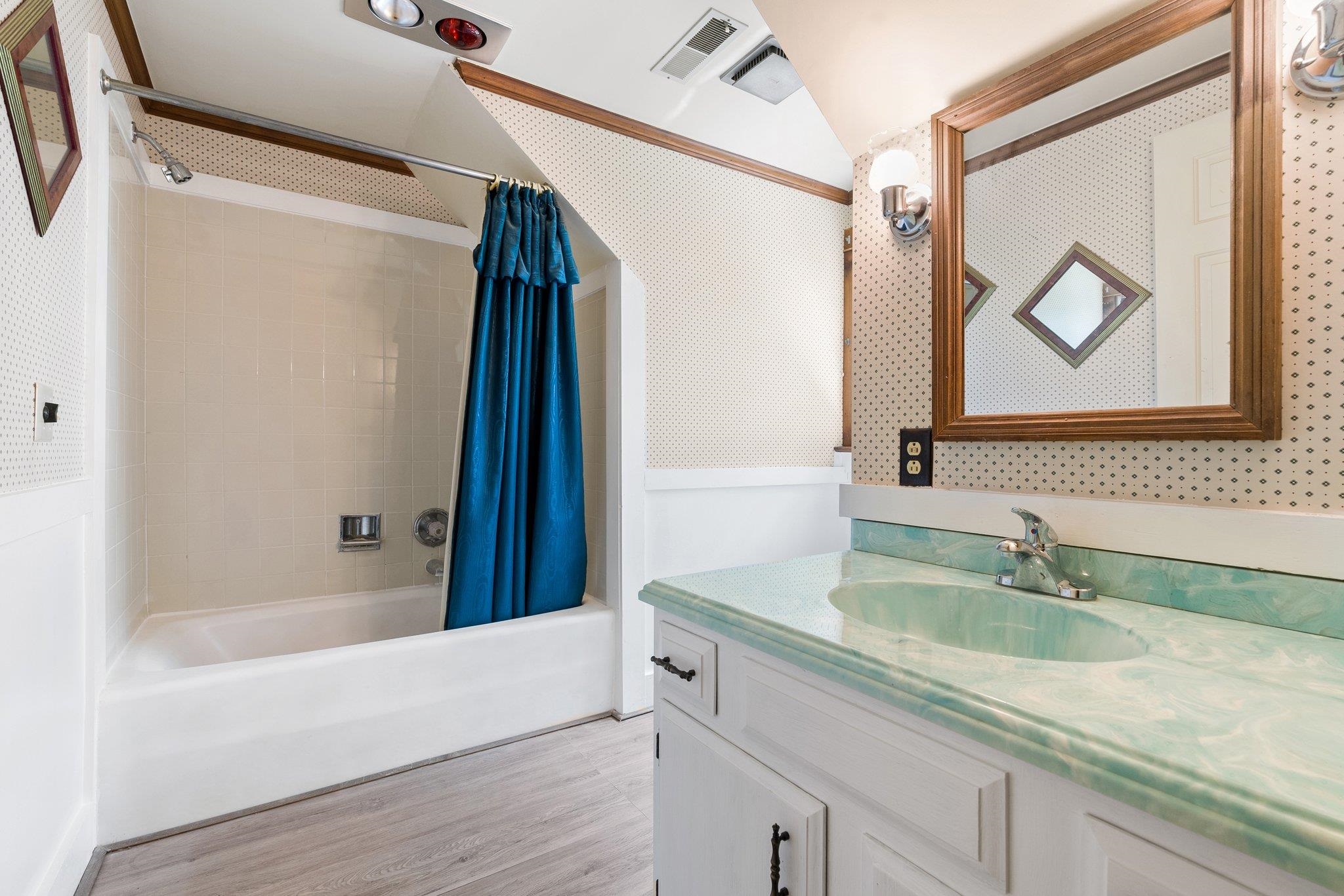 88 Roman Ridge Road Mount Sidney, VA 24467 - Photo 55 of 74 a bathroom with a granite countertop sink a mirror a vanity and bathtub