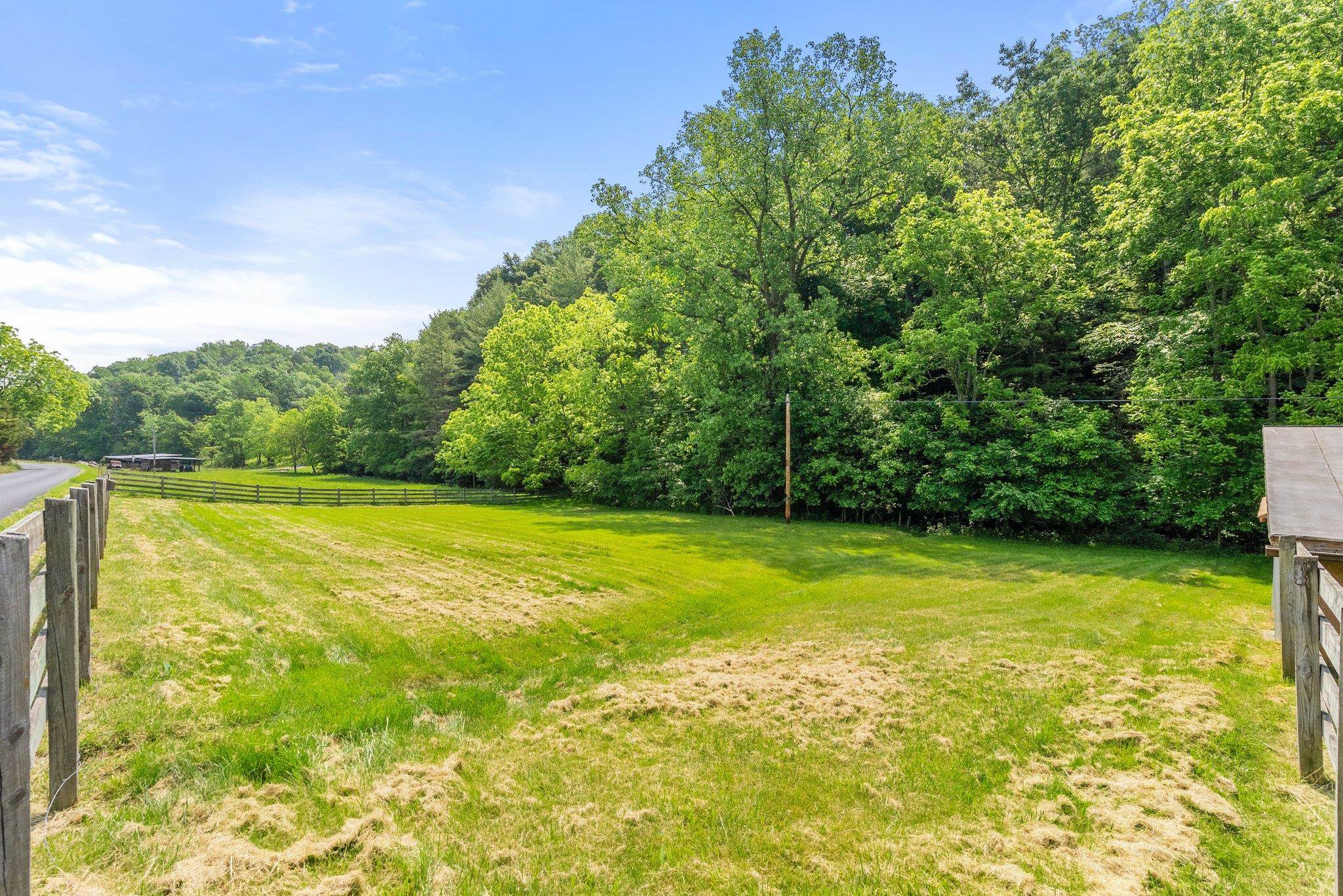 88 Roman Ridge Road Mount Sidney, VA 24467 - Photo 68 of 74 a view of a swimming pool with an outdoor space and seating area