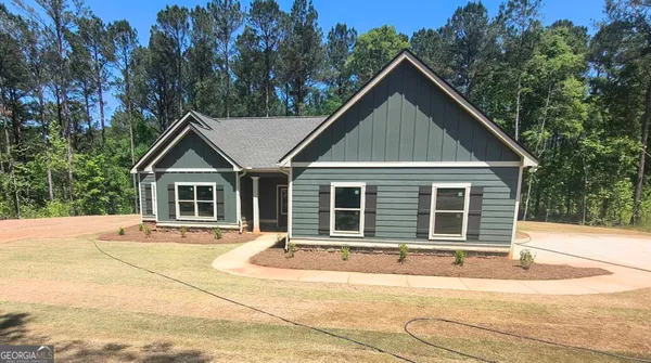 a house with trees in the background