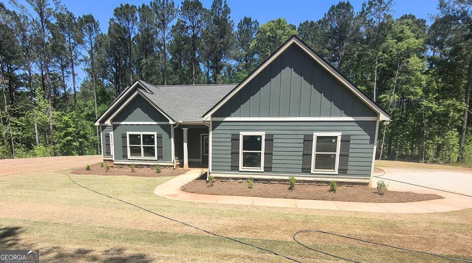 a house with trees in the background
