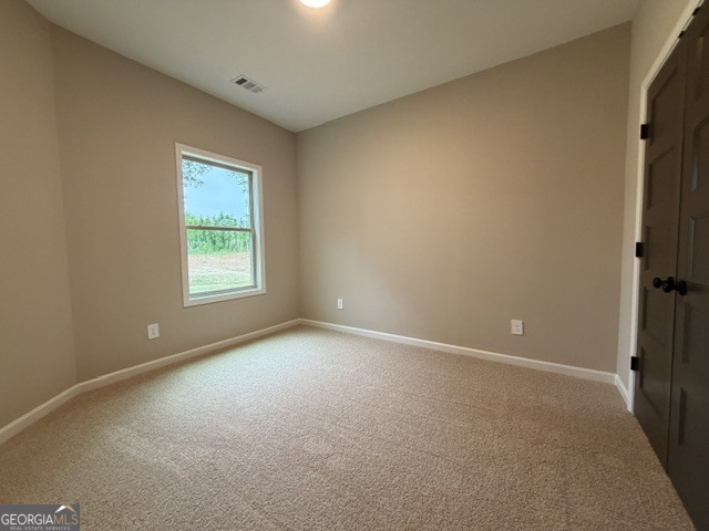 264 Robert Williams Road Greenville, GA 30222 - Photo 18 of 23 an empty room with windows