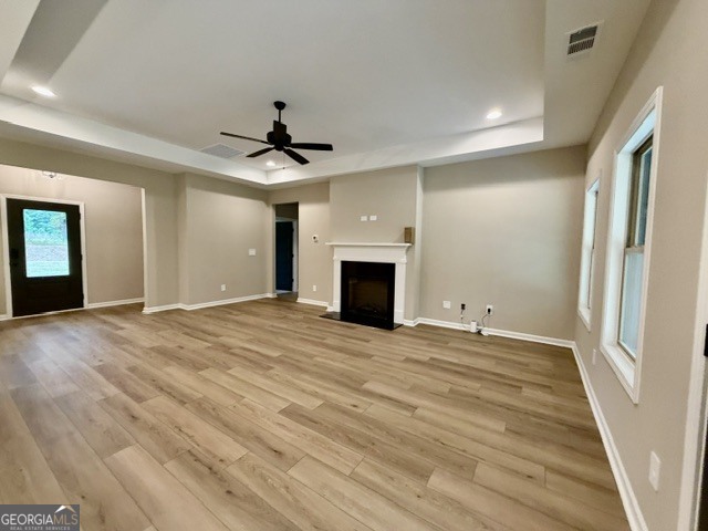 264 Robert Williams Road Greenville, GA 30222 - Photo 2 of 23 wooden floor in an empty room with a fireplace