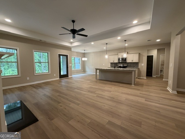 264 Robert Williams Road Greenville, GA 30222 - Photo 5 of 23 an empty room with wooden floor and windows