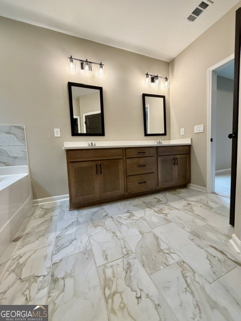 264 Robert Williams Road Greenville, GA 30222 - Photo 10 of 23 a spacious bathroom with a mirror and a sink