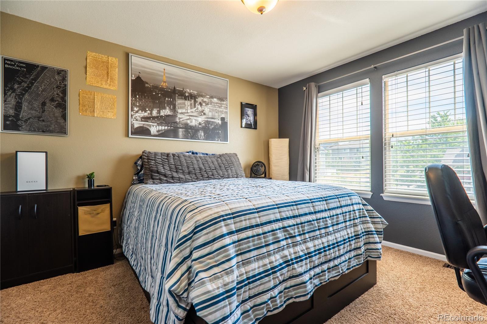 10857 Hickory Ridge Street Highlands Ranch, CO 80126 - Photo 24 of 40 a bedroom with a bed and a large window