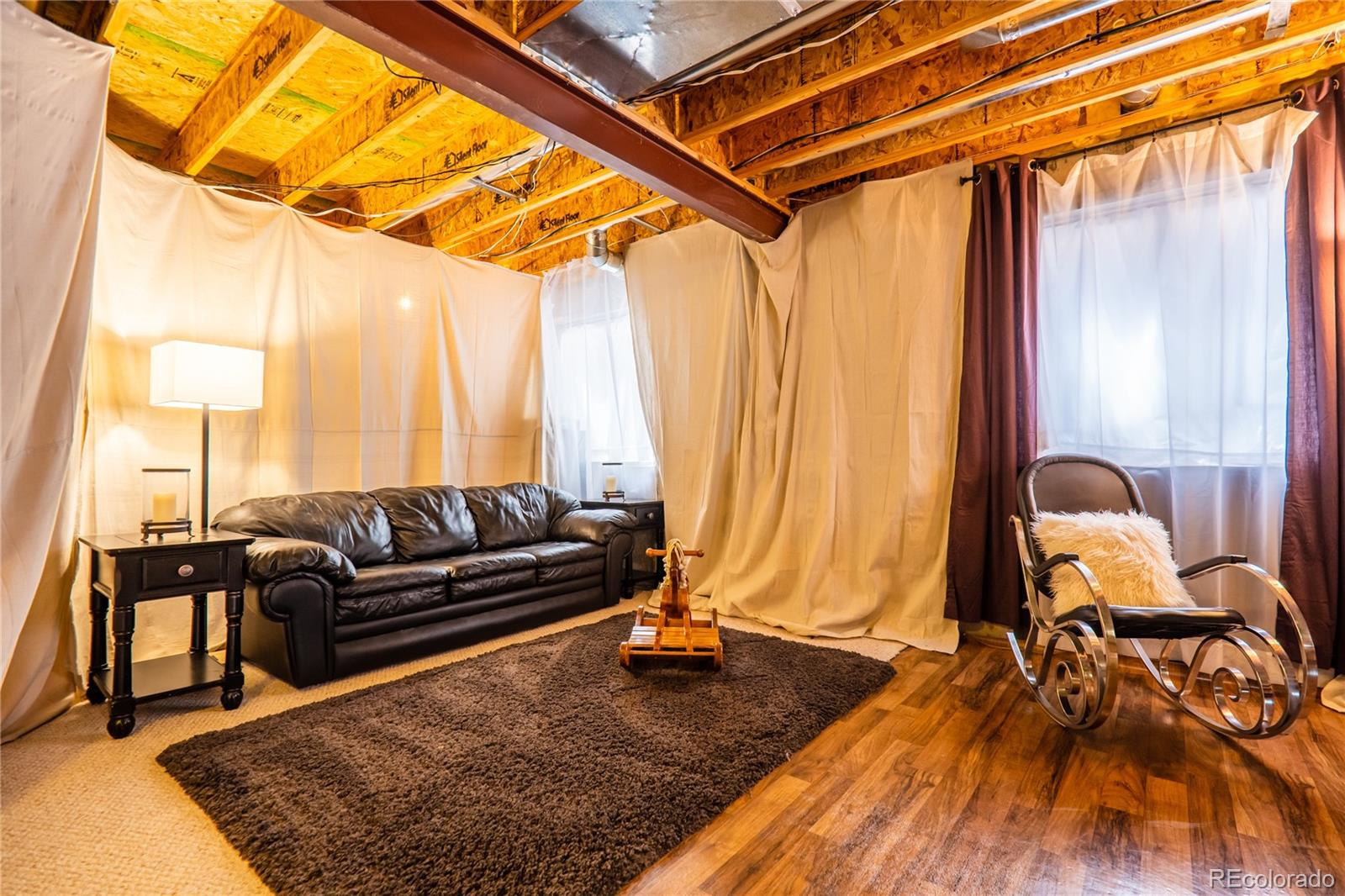 10857 Hickory Ridge Street Highlands Ranch, CO 80126 - Photo 28 of 40 a living room with a couch and a table