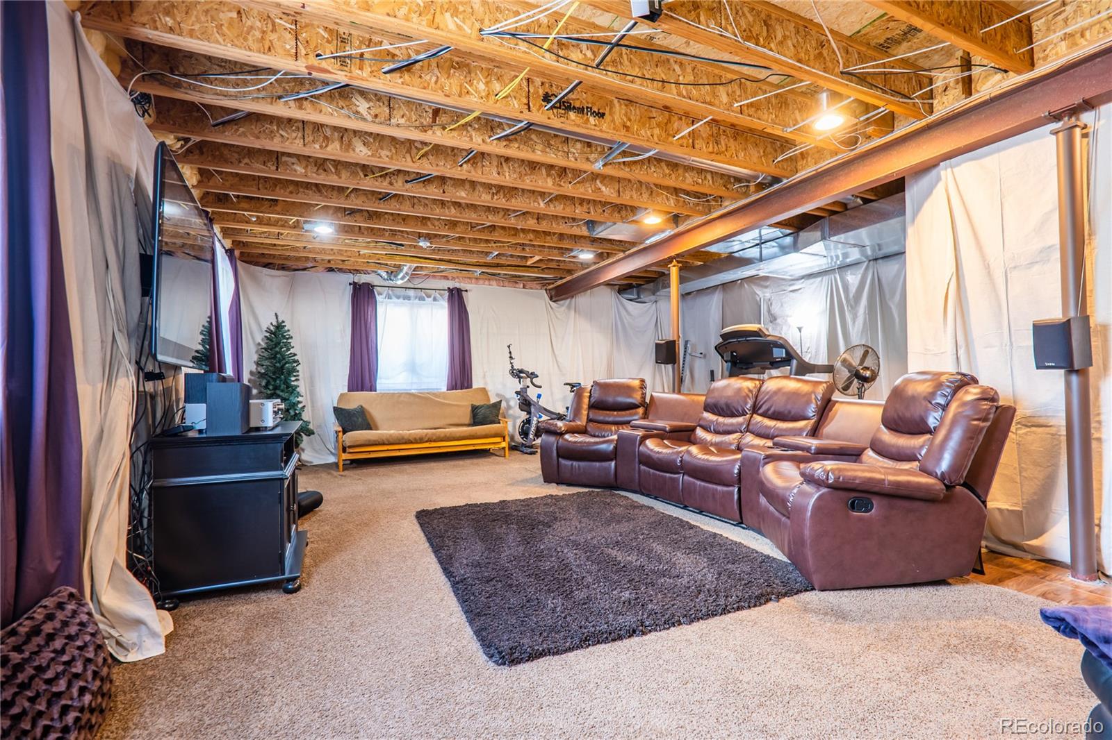 10857 Hickory Ridge Street Highlands Ranch, CO 80126 - Photo 29 of 40 a living room with furniture