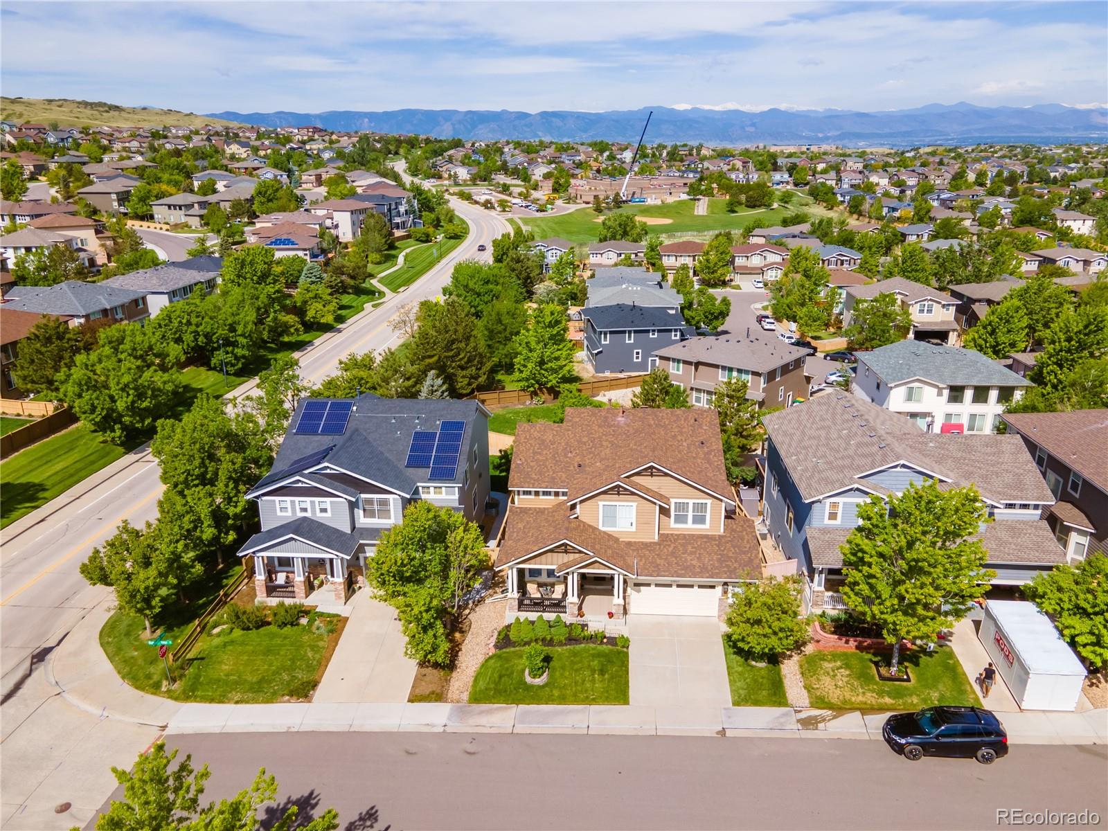 10857 Hickory Ridge Street Highlands Ranch, CO 80126 - Photo 3 of 40 an aerial view of residential houses with outdoor space