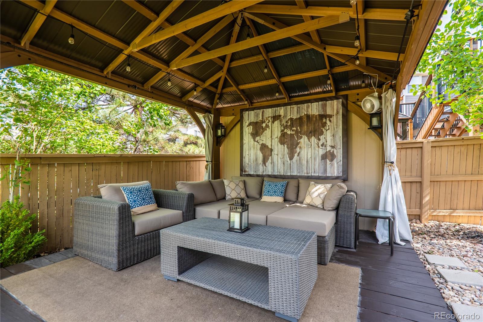 10857 Hickory Ridge Street Highlands Ranch, CO 80126 - Photo 37 of 40 a outdoor living space with patio furniture and a potted plant
