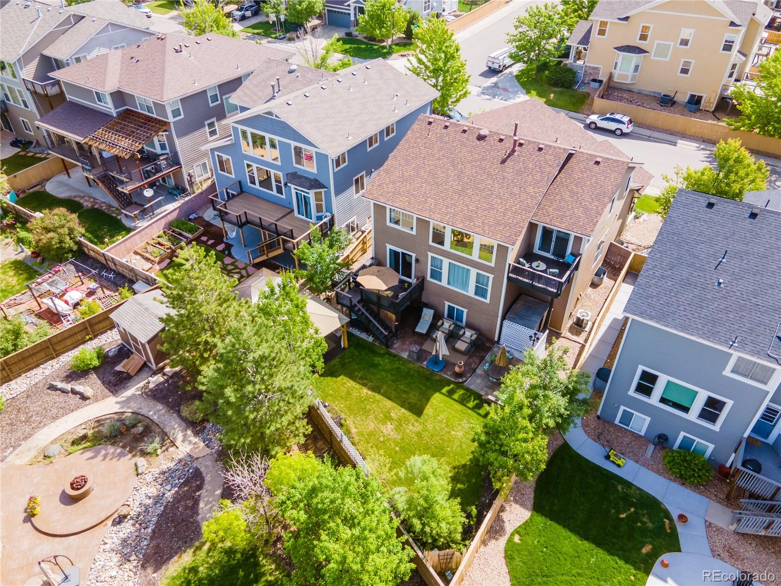 10857 Hickory Ridge Street Highlands Ranch, CO 80126 - Photo 39 of 40 an aerial view of multiple houses with yard