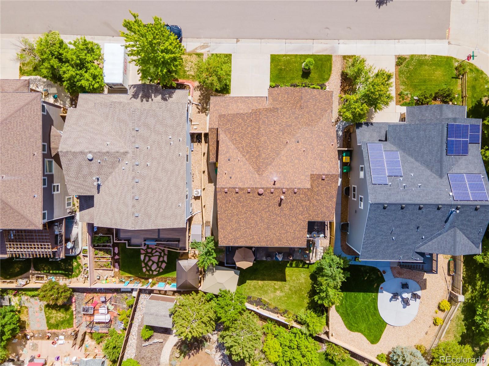 10857 Hickory Ridge Street Highlands Ranch, CO 80126 - Photo 40 of 40 an aerial view of a house with a yard and a large tree