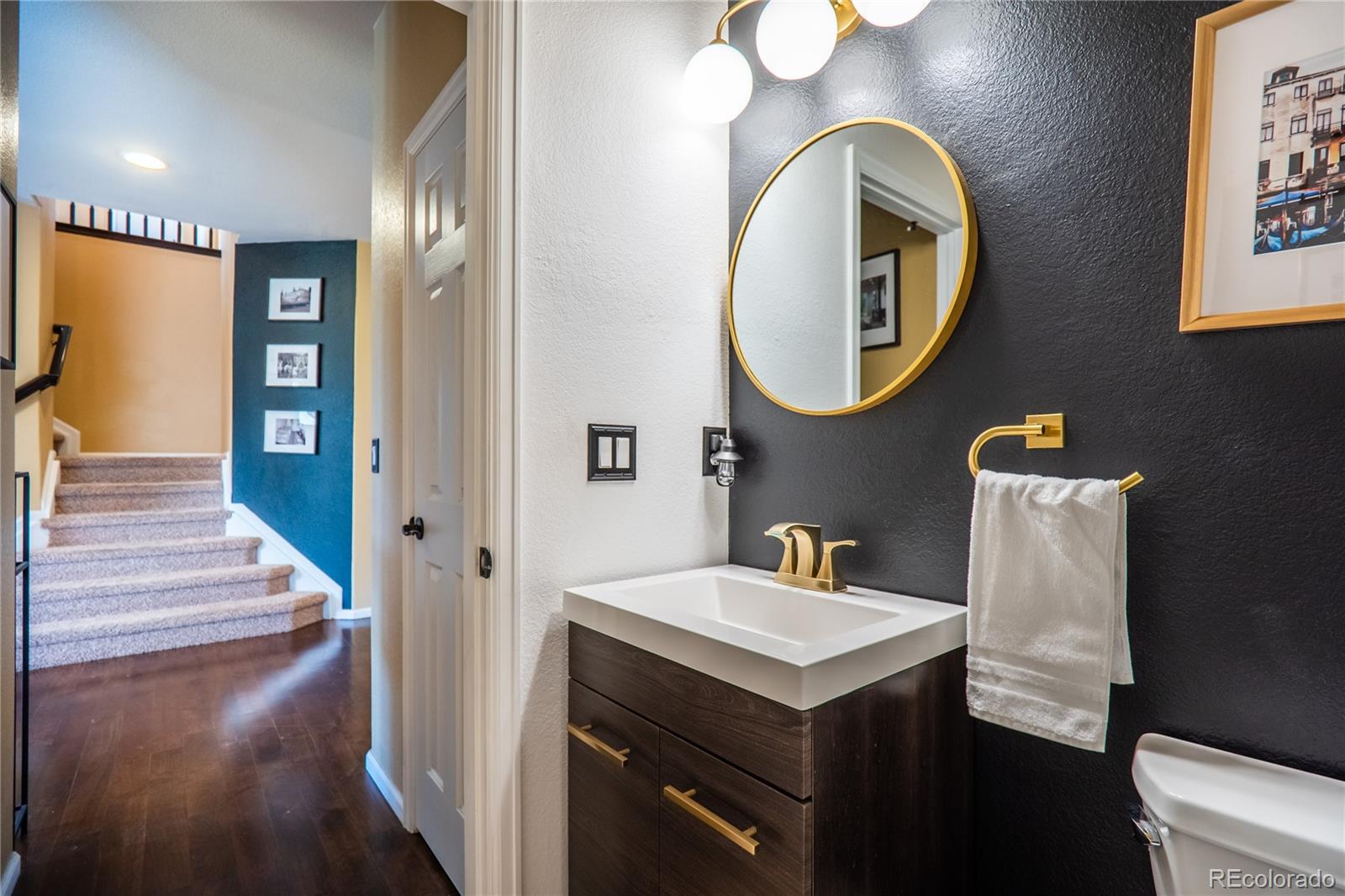 10857 Hickory Ridge Street Highlands Ranch, CO 80126 - Photo 7 of 40 a bathroom with a sink and a mirror