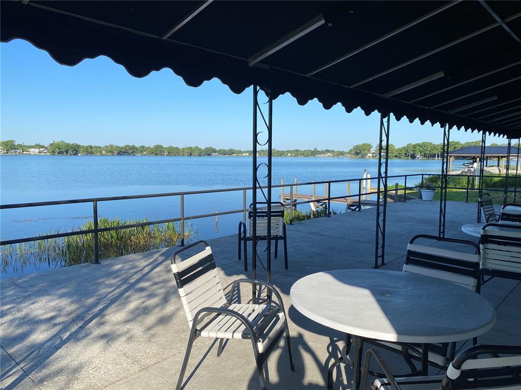 1500 Gay Road, Unit 17D Winter Park, FL 32789 - Photo 33 of 34 a view of a chairs and table in patio