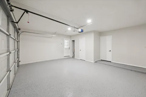 a view of a house with backyard and garden