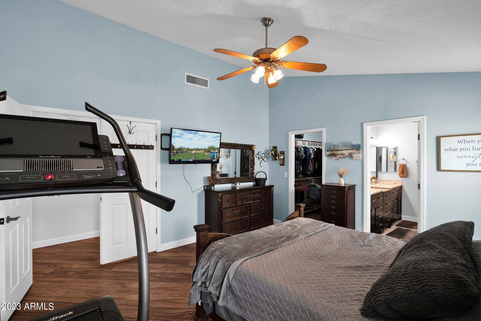 4338 East Douglas Avenue Gilbert, AZ 85234 - Photo 17 of 48 a bedroom with a bed and a flat screen tv