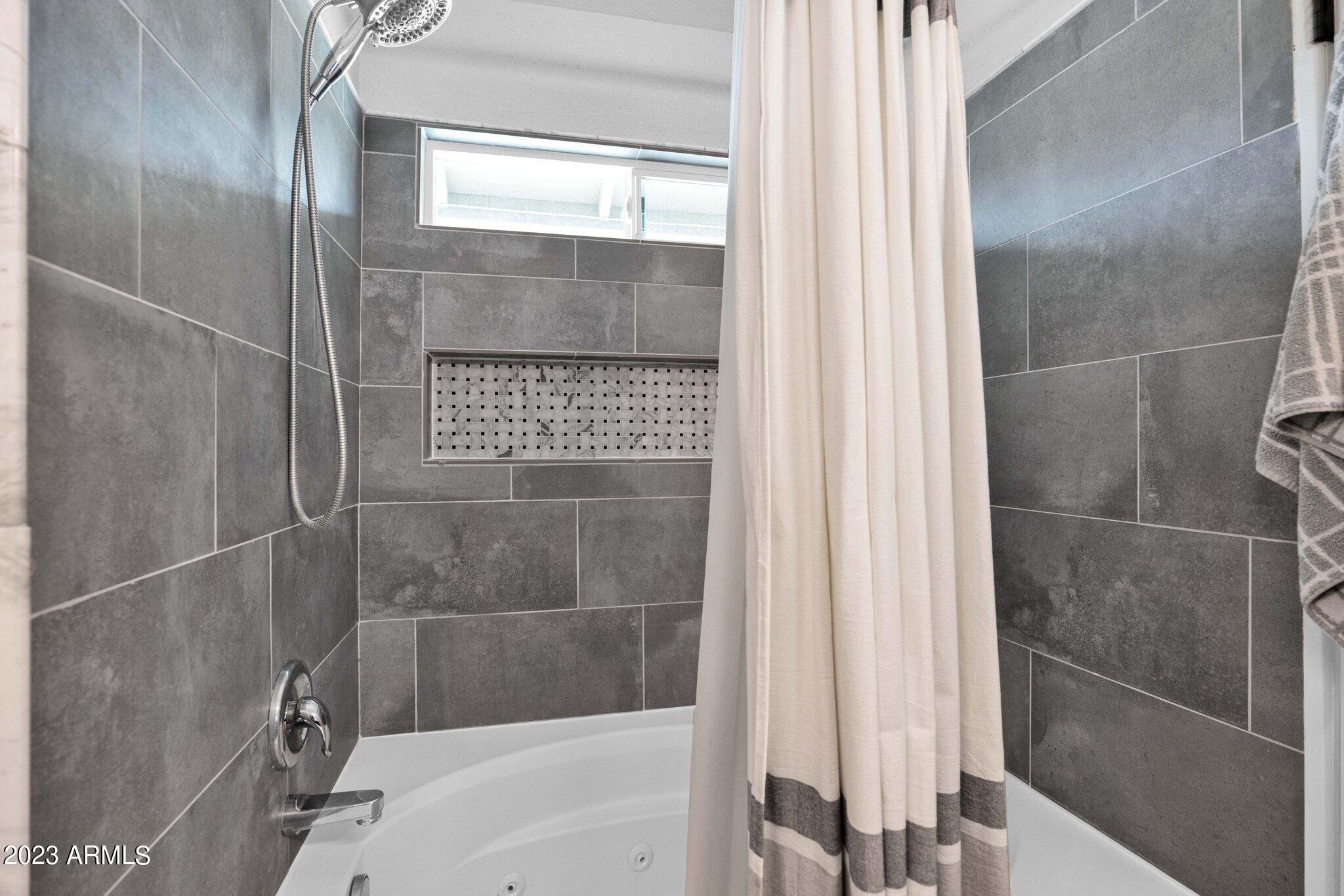 4338 East Douglas Avenue Gilbert, AZ 85234 - Photo 19 of 48 a bathroom with a shower