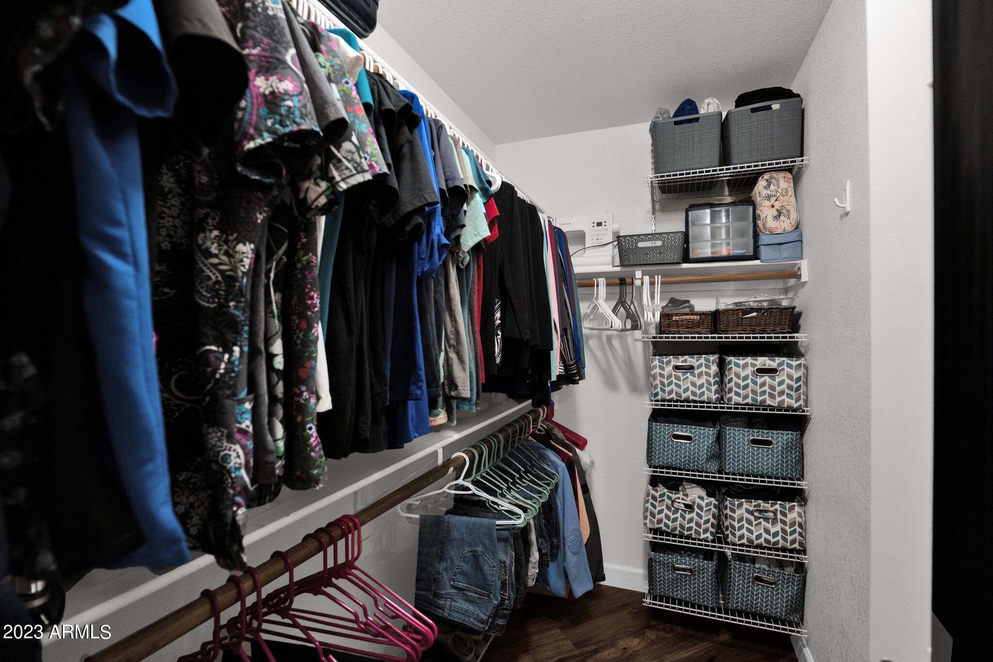 4338 East Douglas Avenue Gilbert, AZ 85234 - Photo 20 of 48 a view of walk in closet with clothes and shoes