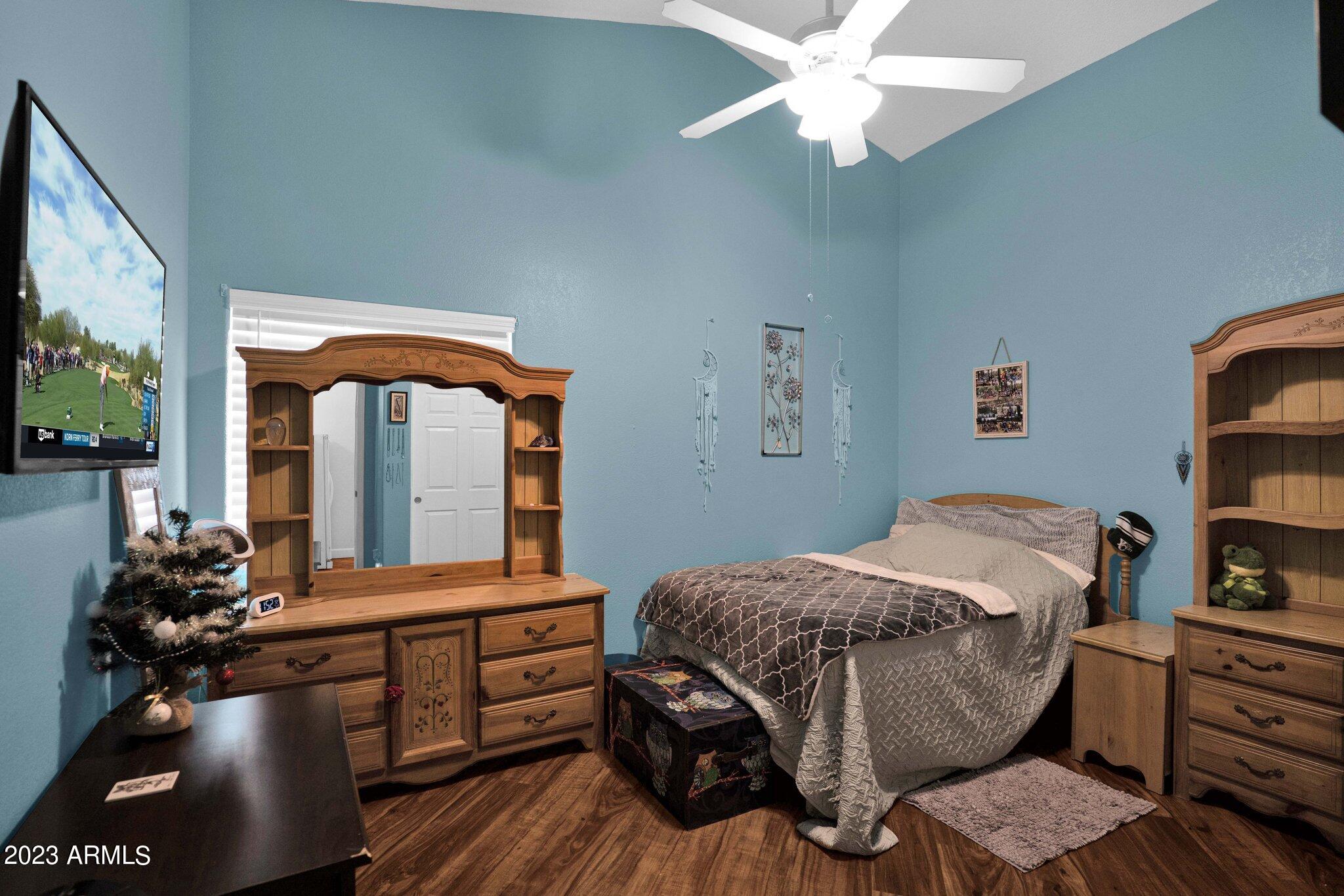 4338 East Douglas Avenue Gilbert, AZ 85234 - Photo 21 of 48 a room with furniture and wooden floor