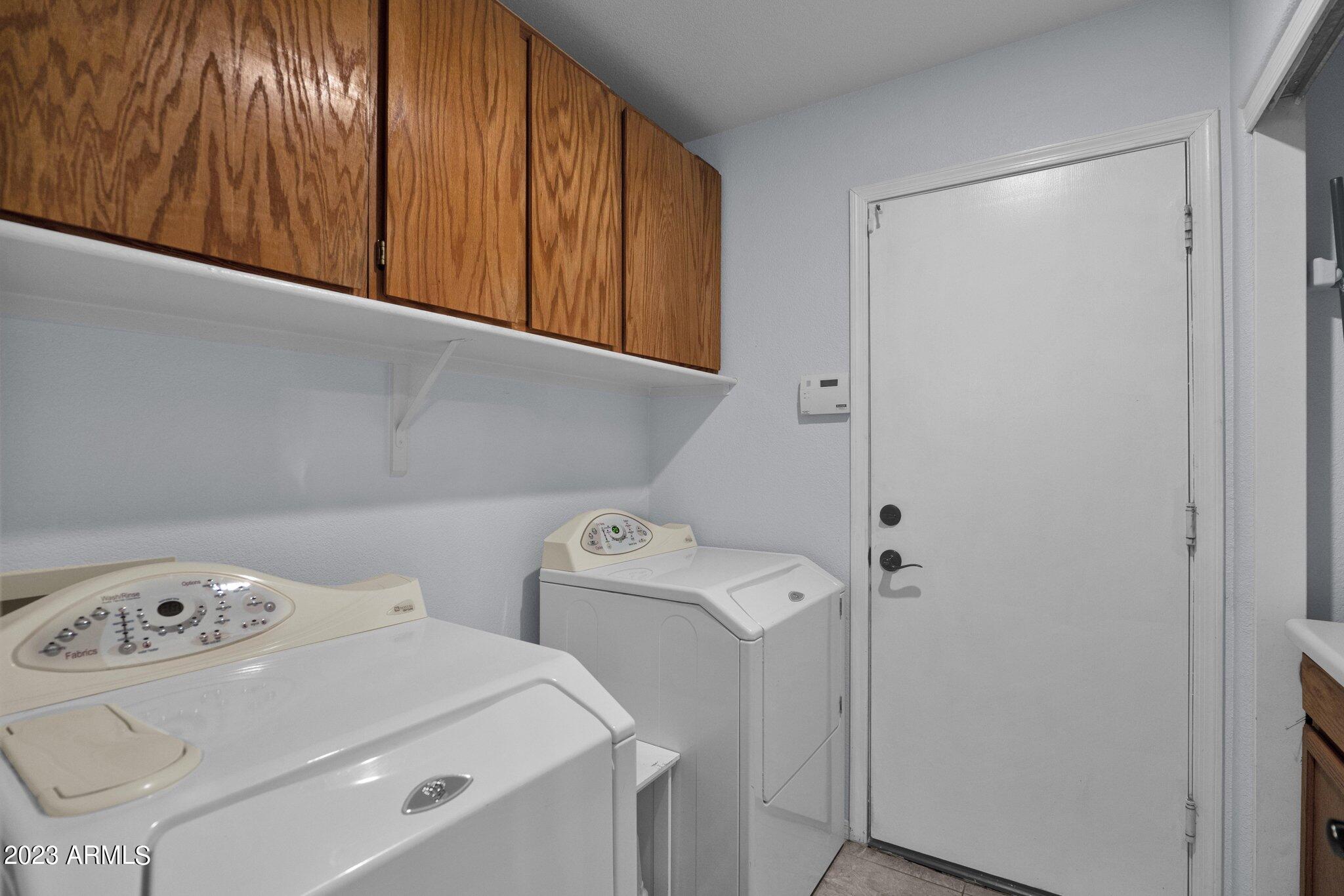 4338 East Douglas Avenue Gilbert, AZ 85234 - Photo 24 of 48 a utility room with dryer and washer