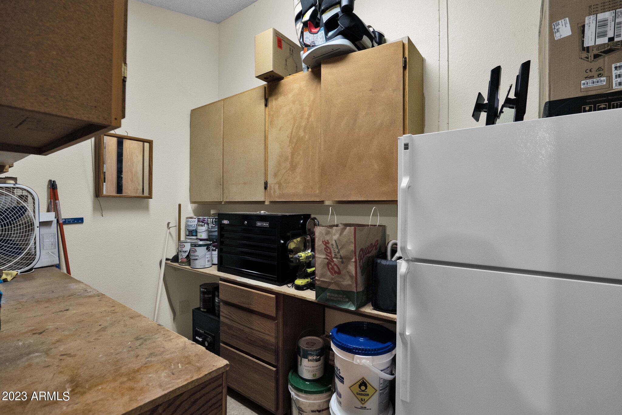 4338 East Douglas Avenue Gilbert, AZ 85234 - Photo 25 of 48 a kitchen with a refrigerator and a sink