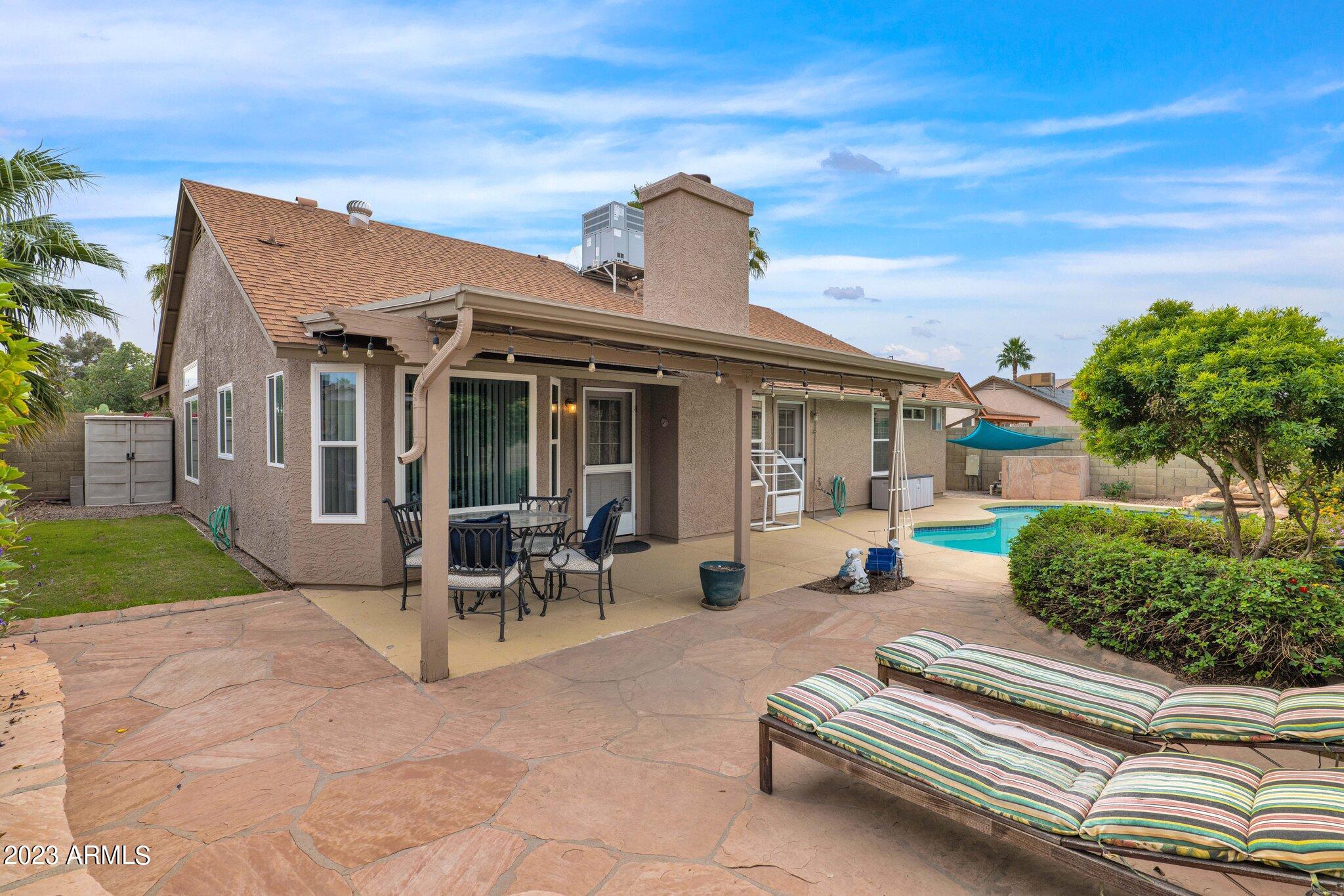4338 East Douglas Avenue Gilbert, AZ 85234 - Photo 30 of 48 a view of a house with backyard and porch