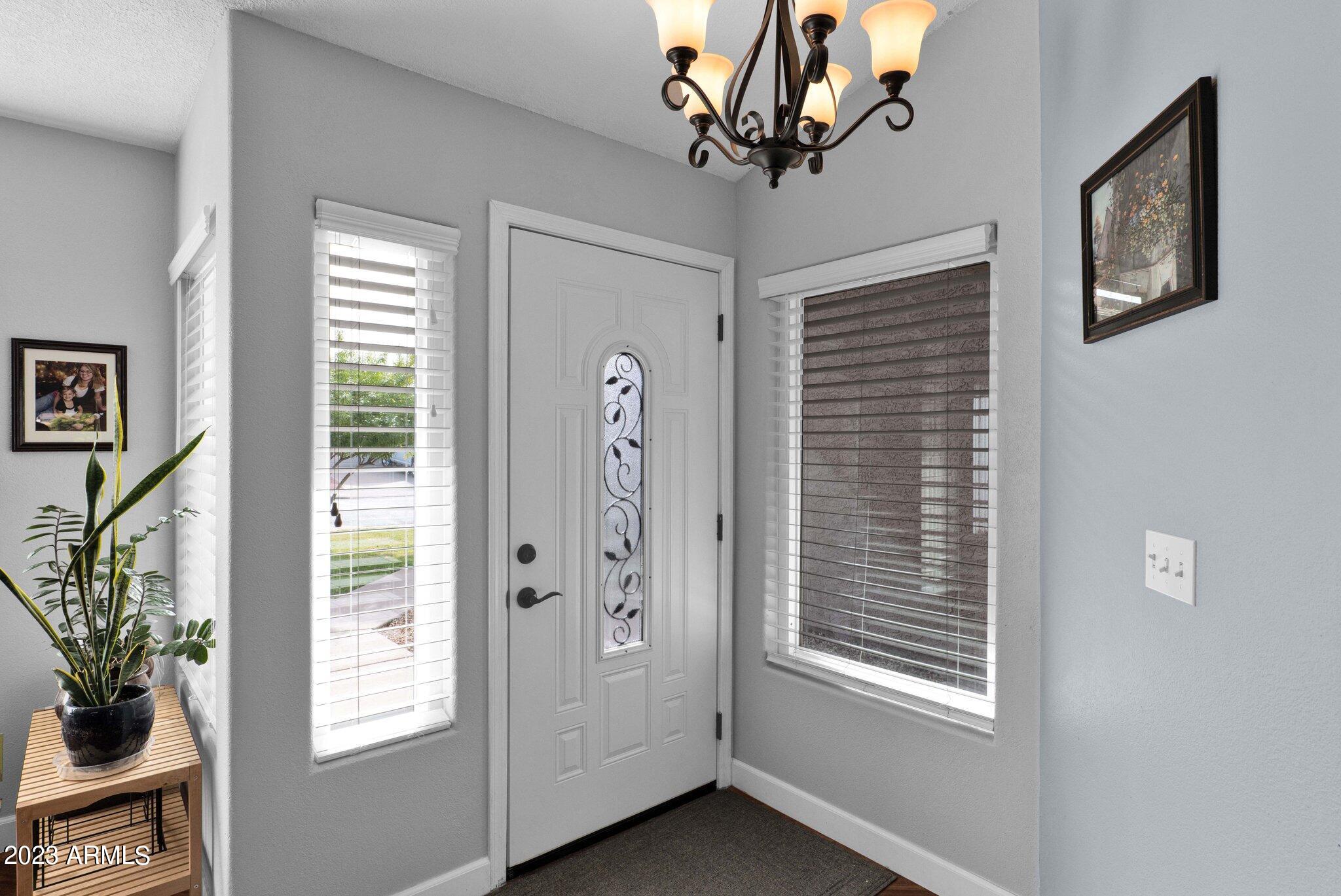 4338 East Douglas Avenue Gilbert, AZ 85234 - Photo 5 of 48 a view of a livingroom with a potted plant