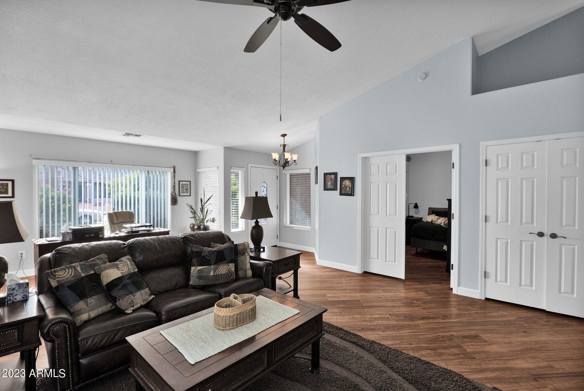 4338 East Douglas Avenue Gilbert, AZ 85234 - Photo 8 of 48 a living room with furniture and a ceiling fan