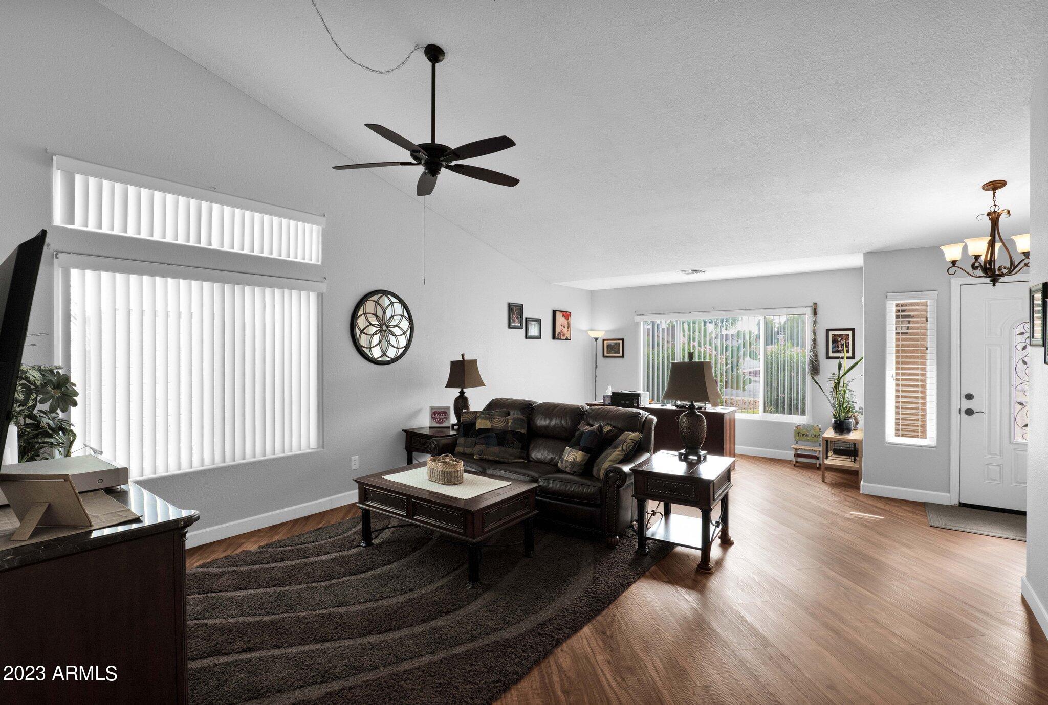 4338 East Douglas Avenue Gilbert, AZ 85234 - Photo 9 of 48 a living room with furniture wooden floor and a window
