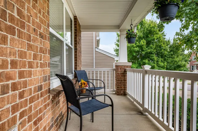 a view of a chair and table in the balcony