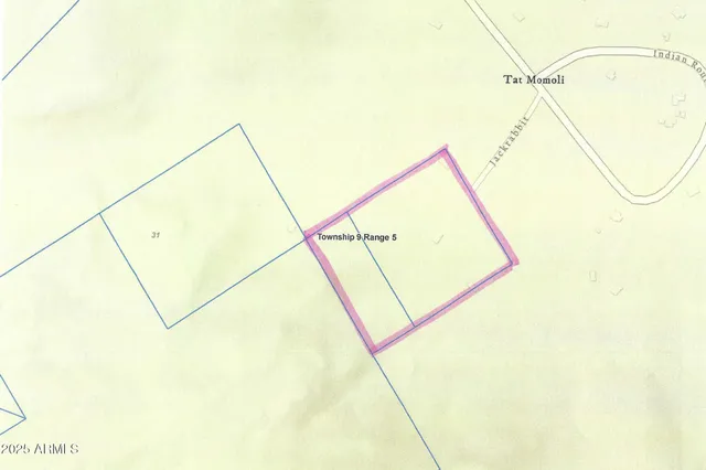 a view of a room with a wall and a window