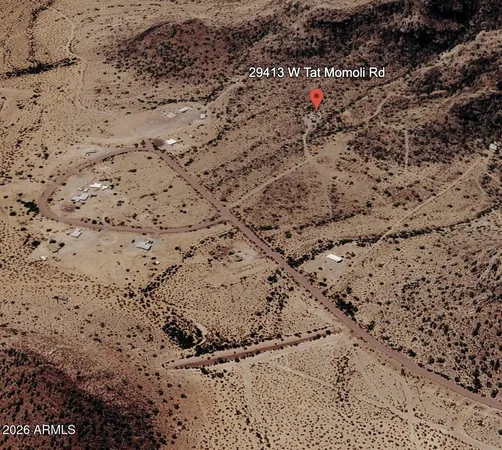 a view of a dry yard covered with snow