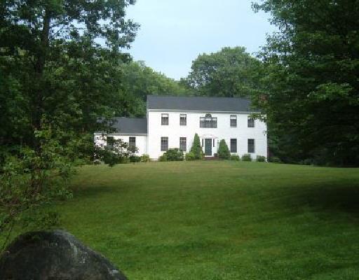 254 Thunder Lake Road Wilton, CT 06897 - Photo 1 of 1 a view of a white house with a big yard and large trees