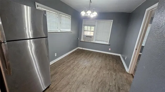 a view of a room with wooden floor and staircase