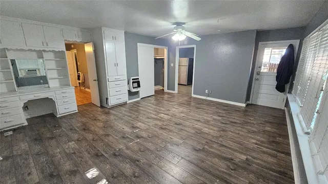 a view of livingroom with hardwood floor and a ceiling fan