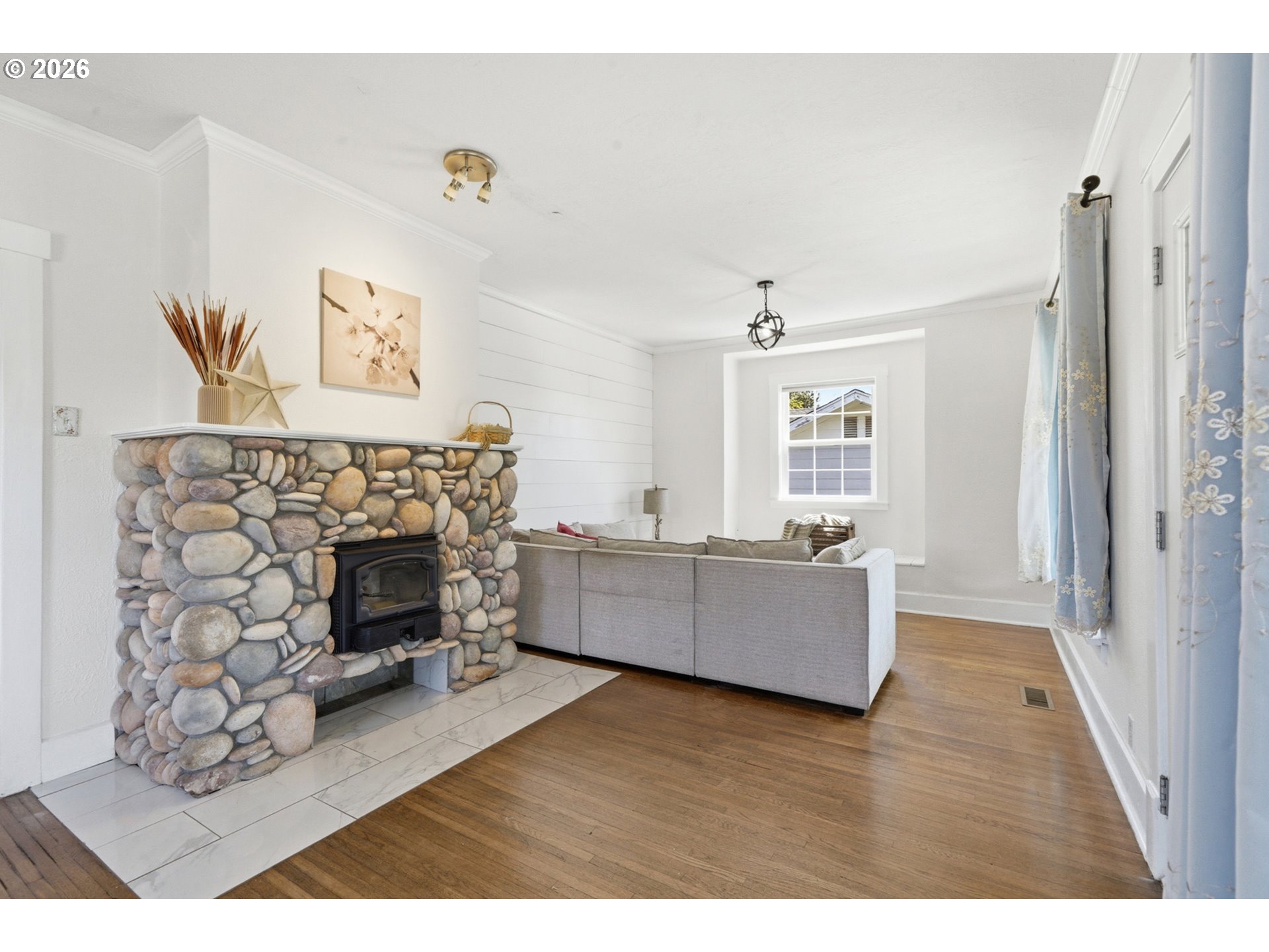 1802 8th Street Tillamook, OR 97141 - Photo 7 of 37 a living room with furniture and a fireplace