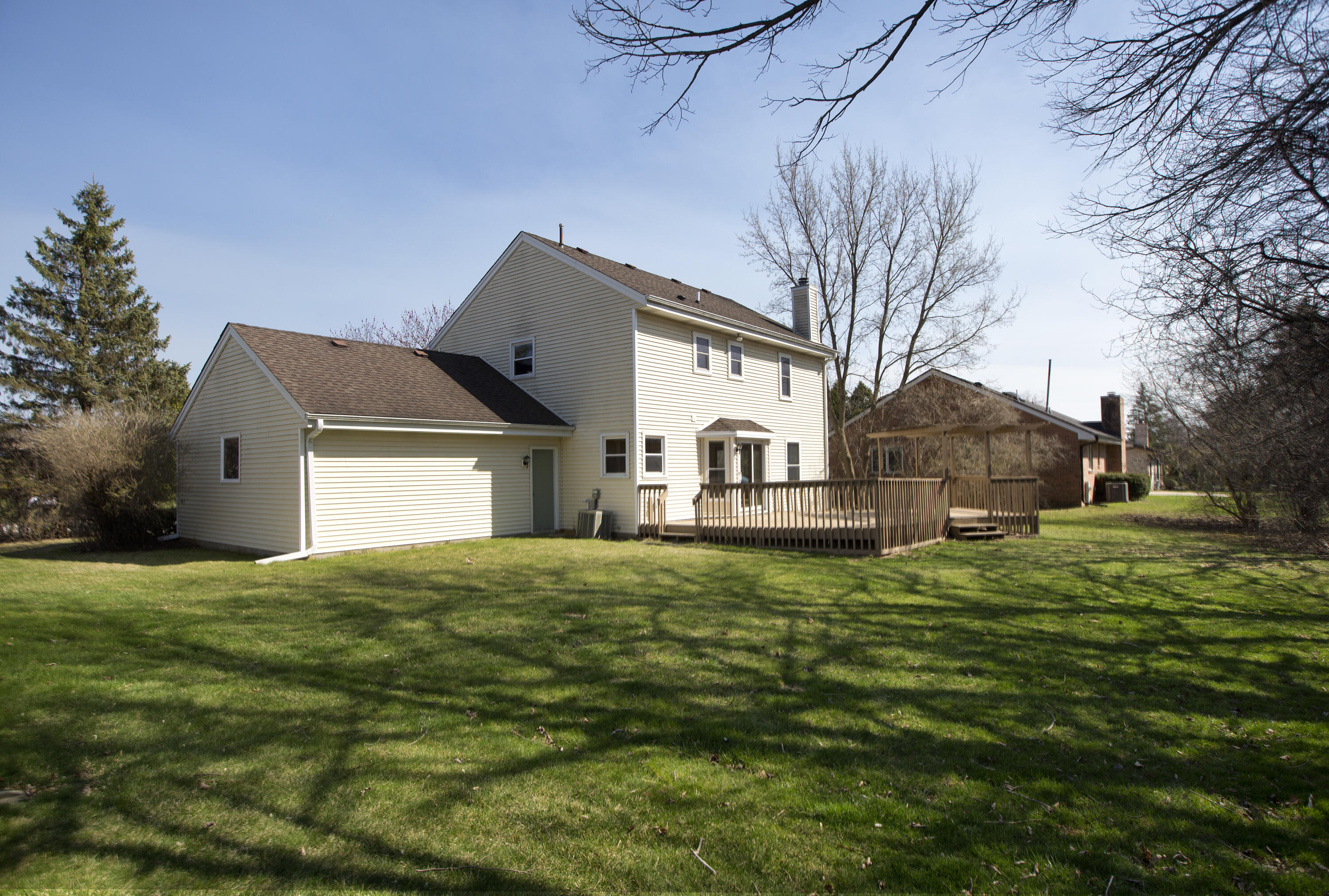4445 South Longview Drive New Berlin, WI 53151 - Photo 22 of 25 Spacious Tree-lined Backyard