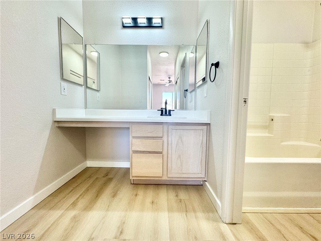 7340 Ridge Star Court Las Vegas, NV 89131 - Photo 5 of 22 A clean, modern bathroom vanity with generous counter space, perfect for daily routines.
