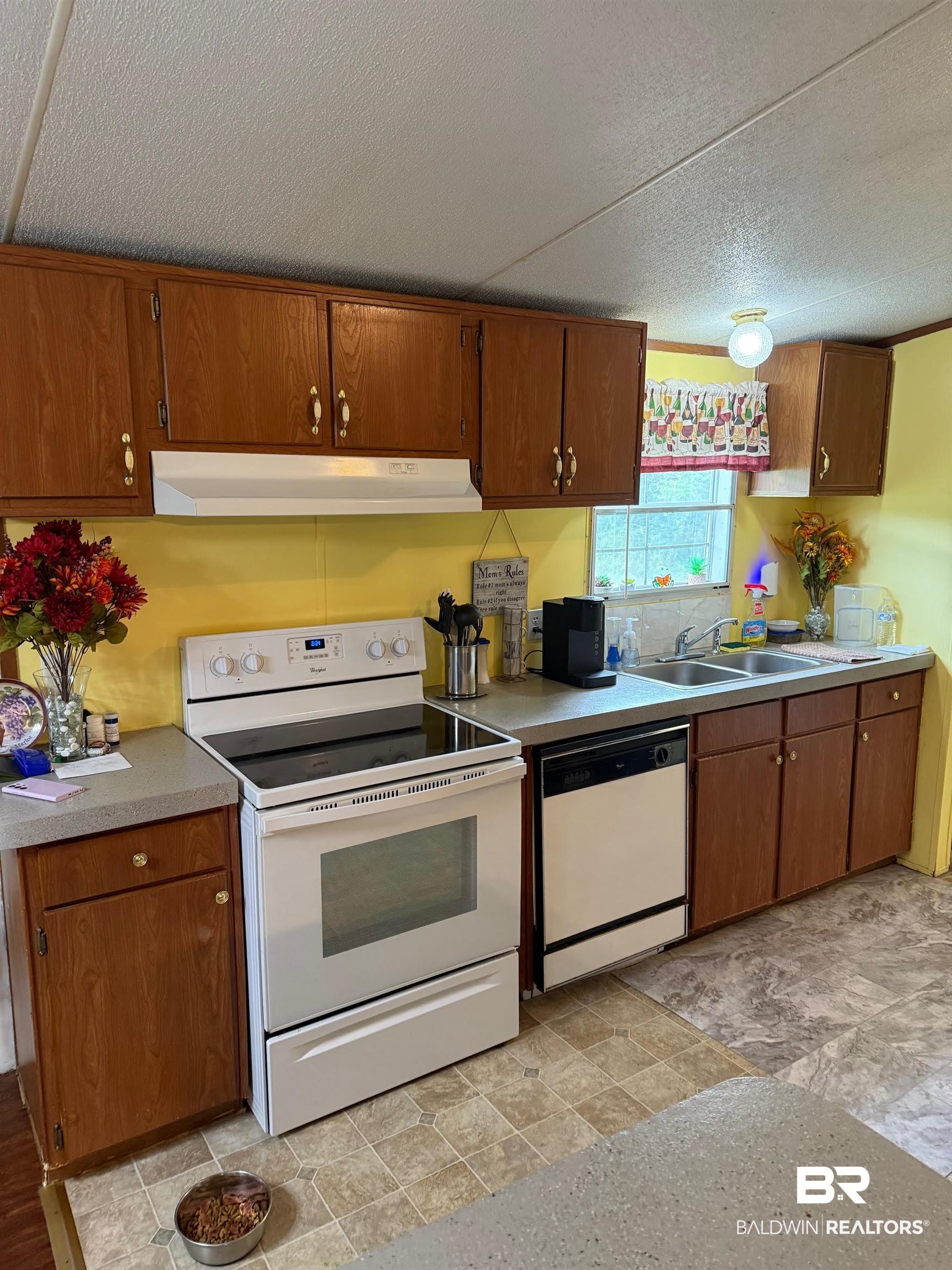 15844 County Road 87 Elberta, AL 36530 - Photo 16 of 28 Kitchen featuring a textured ceiling, sink, and white appliances