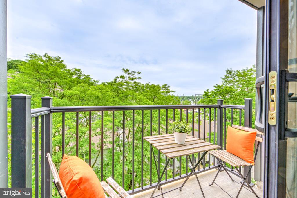 5001 Umbria Street, Unit P215 Philadelphia, PA 19128 - Photo 6 of 20 a balcony with chairs