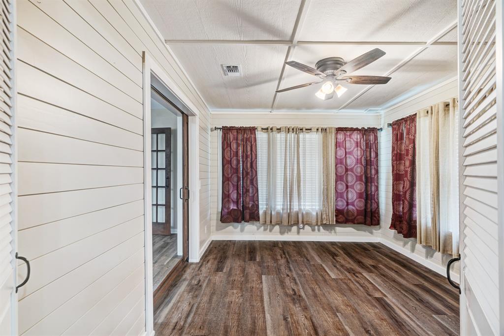 201 Farm To Market 906 Powderly, TX 75473 - Photo 13 of 37 a view of a room with wooden walls and a window