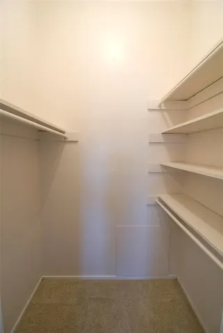 a view of an empty walk in closet