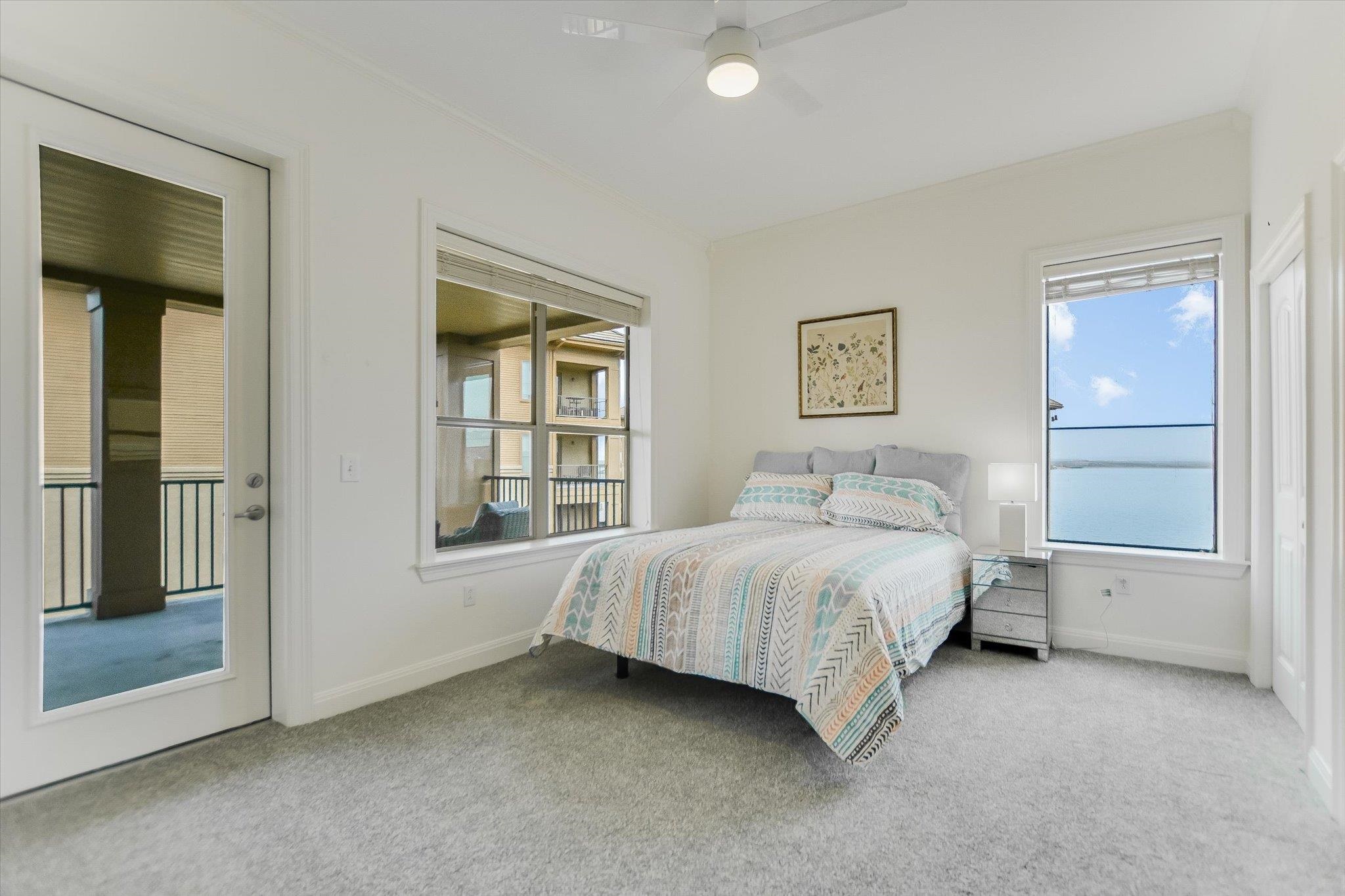 101 West Bank, Unit 52 Horseshoe Bay, TX 78657 - Photo 14 of 30 a bed sitting in a bedroom next to a window