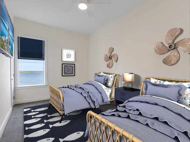 a bedroom with furniture and a window